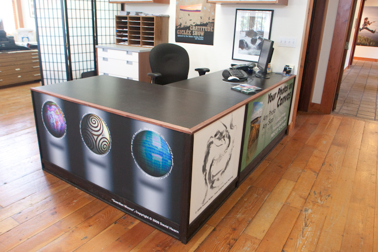 Fine Balance Imaging Studios uses changeable panels in their desks to exhibit their clients' art and promote their own services. (www.fbistudios.com)