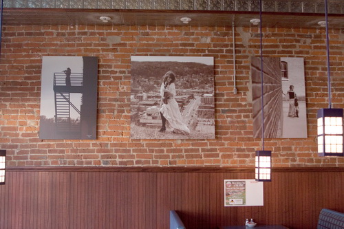 Becker chose to print sepia-toned images to complement the brick walls of the restaurant Potter's on Main. 